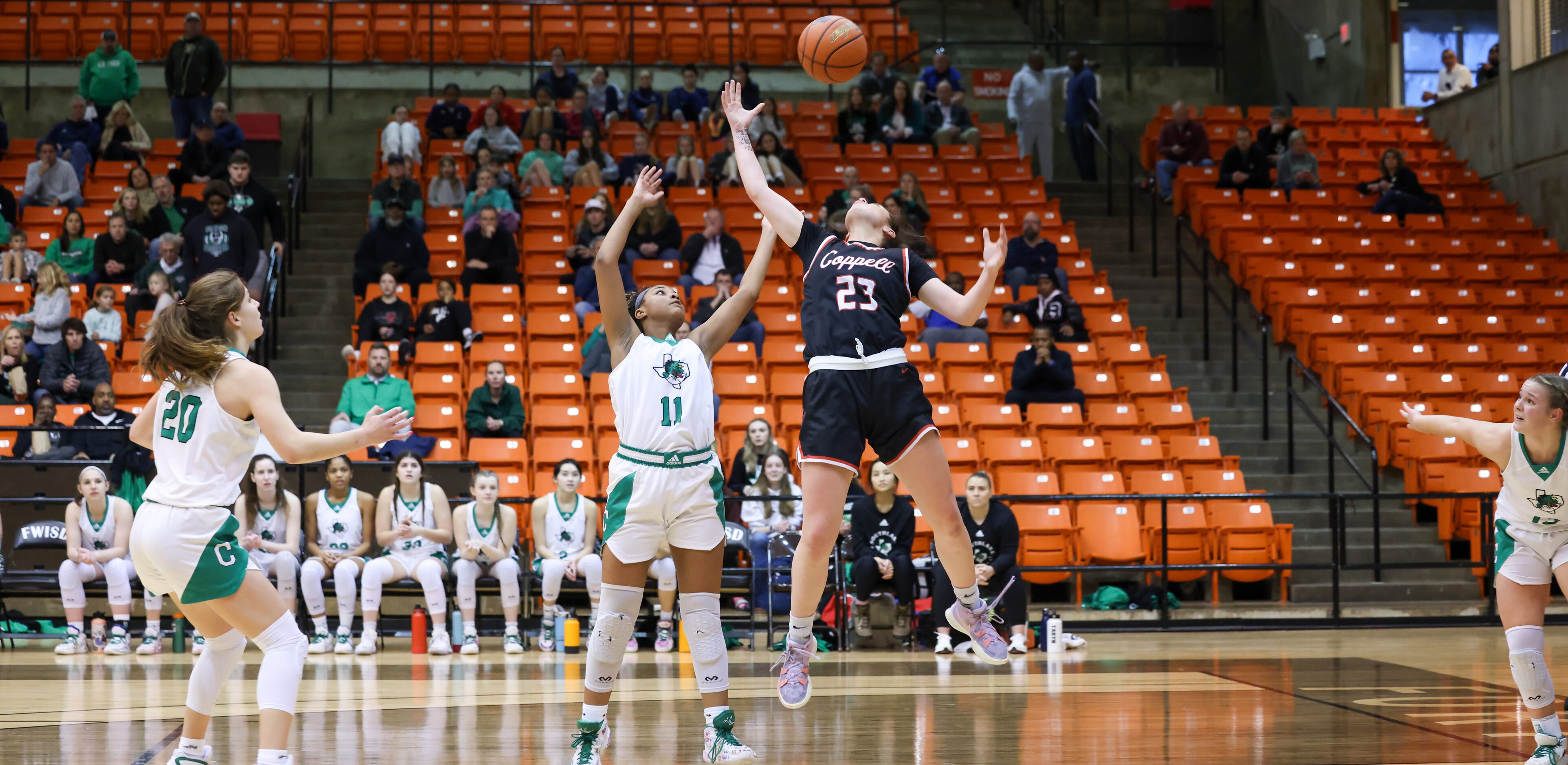 Southlake Carroll freshman guard Natalia Jordan (11) and Coppell junior guard Ella Spiller...