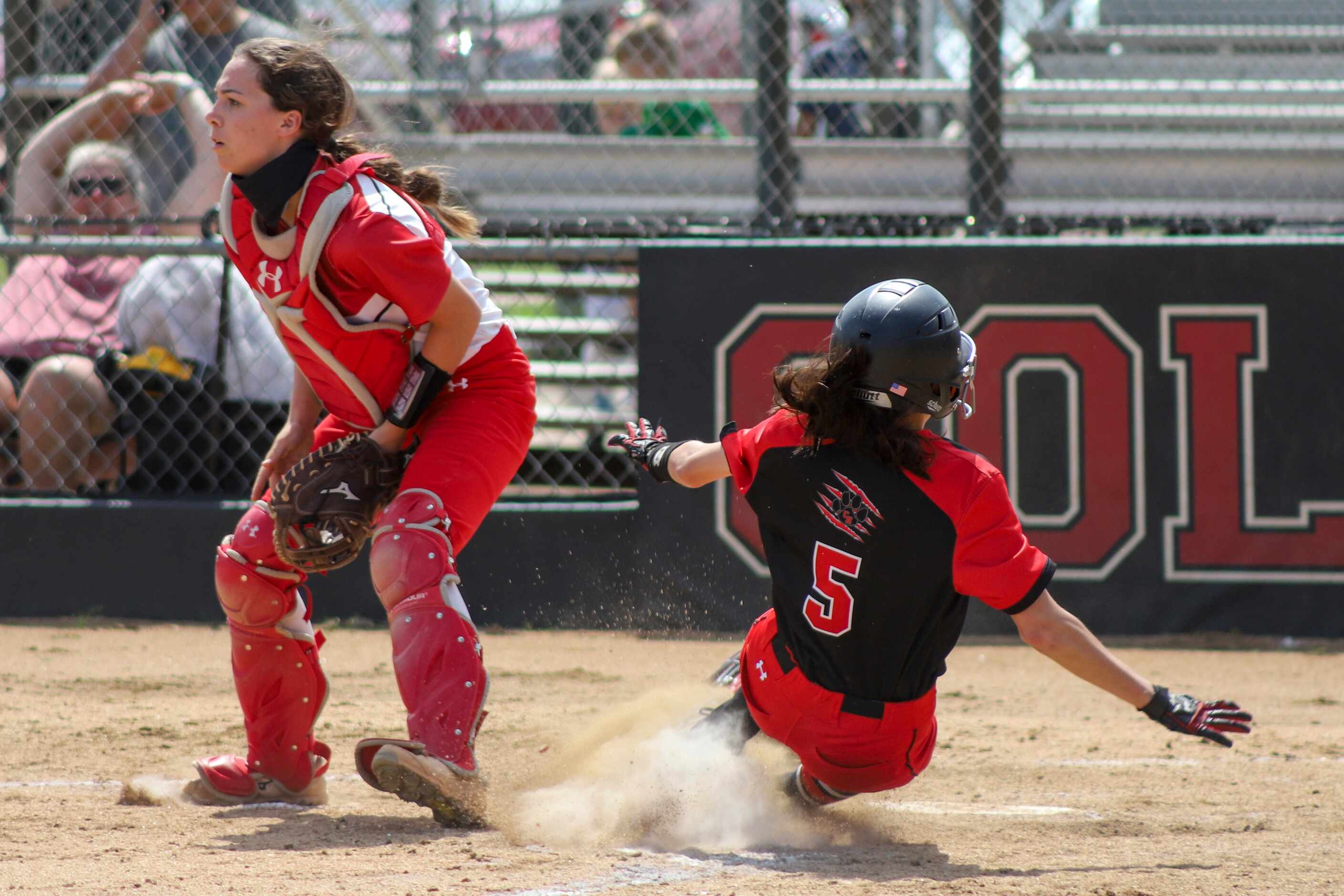 Colleyville Heritage second baseman Leah Perales (5) safely steals home to win the game...