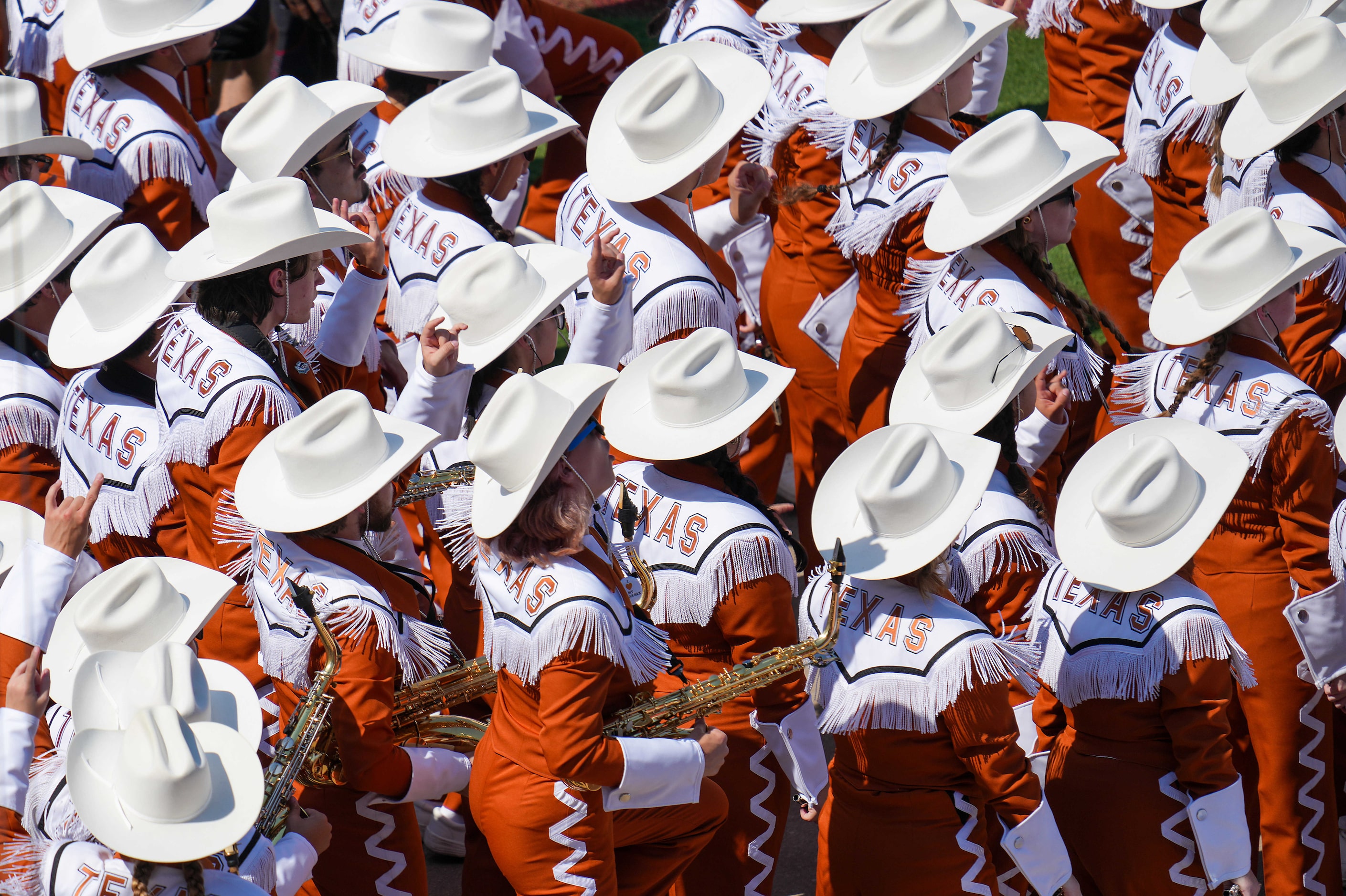 The Texas band enters the stadium before an NCAA college football game against Oklahoma at...