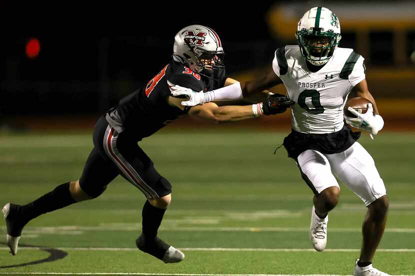 Prosper wide receiver Tyler Bailey (0) gets past Flower Mound Marcus defensive lineman...