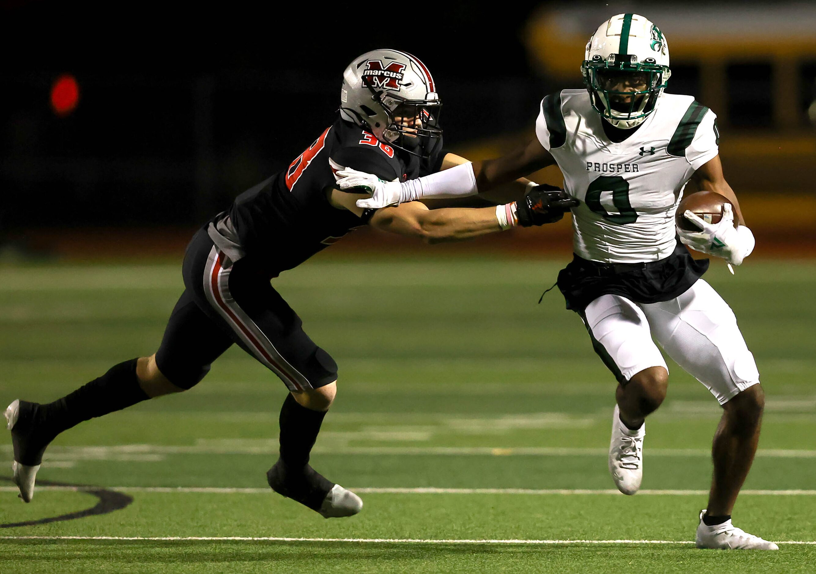 Prosper wide receiver Tyler Bailey (0) gets past Flower Mound Marcus defensive lineman...