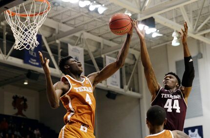 FILE - In this Oct. 25, 2017, file photo, Texas forward Mohamed Bamba (4) grabs a rebound...