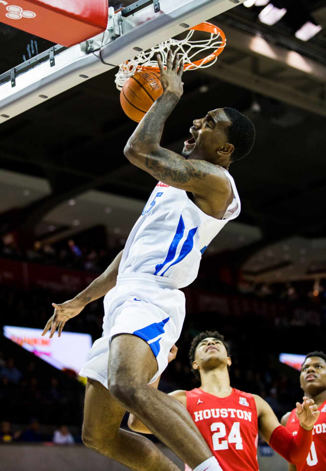 Southern Methodist Mustangs forward Isiaha Mike (15) dunks the ball during the first half of...