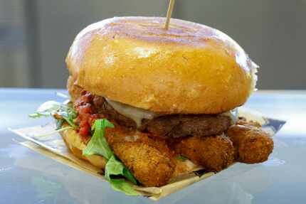 The fried mozzarella burger is a new concession item at Dallas Cowboys games at AT&T Stadium...