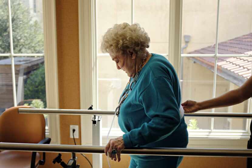 Jo Ann Dunn takes part in a therapy session in the Skilled Nursing wing of The Plaza at...