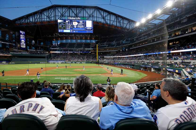 Texas Rangers fans for the first time take in an evening exhibition game at Globe Life Field...