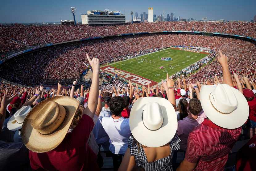 Oklahoma fans cheer the opening kickoff of the annual Red River Showdown football game...