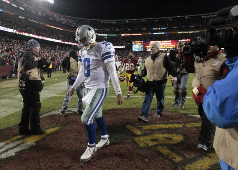 Dallas Cowboys quarterback Tony Romo (9) walks off the field after their loss to the...