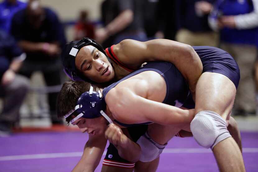 Elise Brown Ton of Allen wrestles during the UIL Texas State Wrestling Championships,...