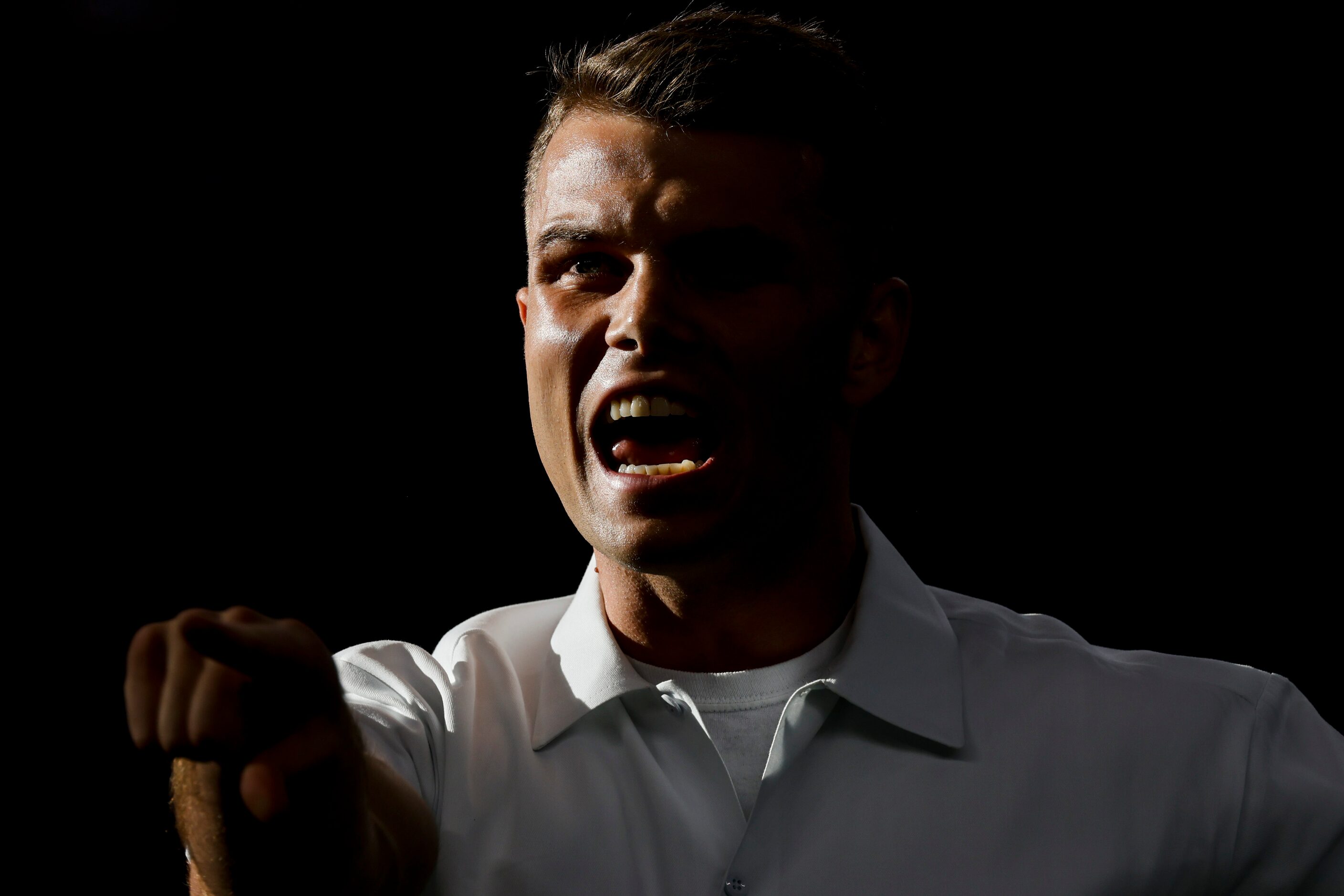 A Texas A&M yell leader leads the 12th Man in the school anthem before the first half of a...