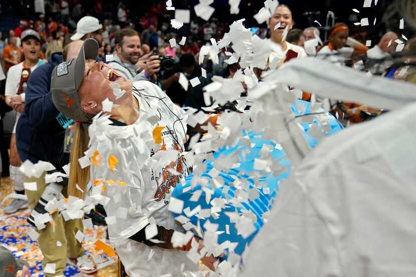 Texas's Emma Halter (2) celebrates with her teammates after winning the NCAA Division I...