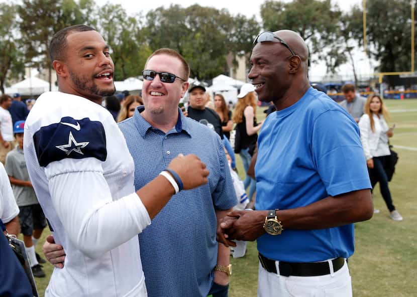 Dallas Cowboys quarterback Dak Prescott (4) meets with one of his agents, Rick Roberts...