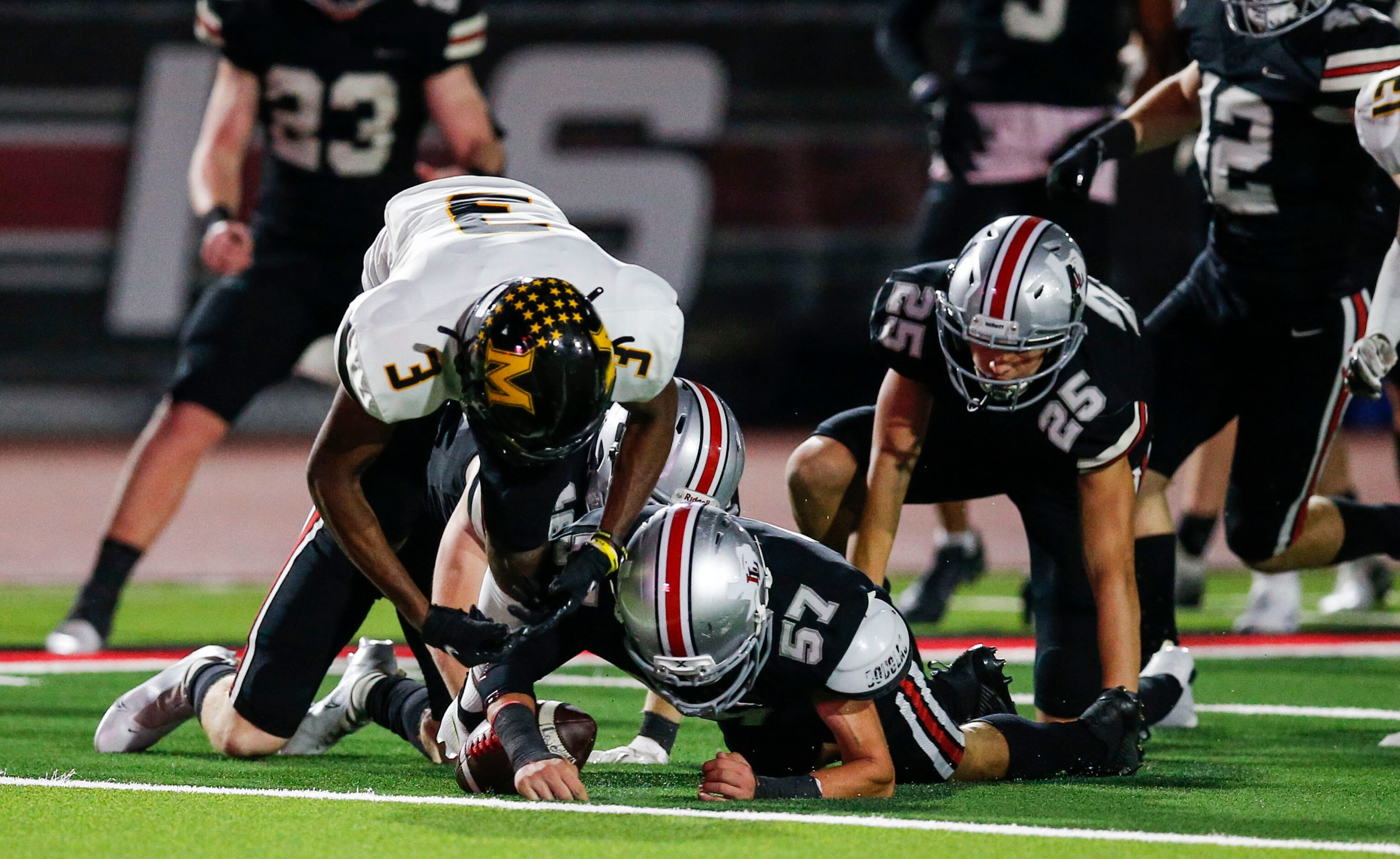 Lovejoy junior Reid Jacob (57) recovers a fumble by Frisco Memorial sophomore David Wilson,...