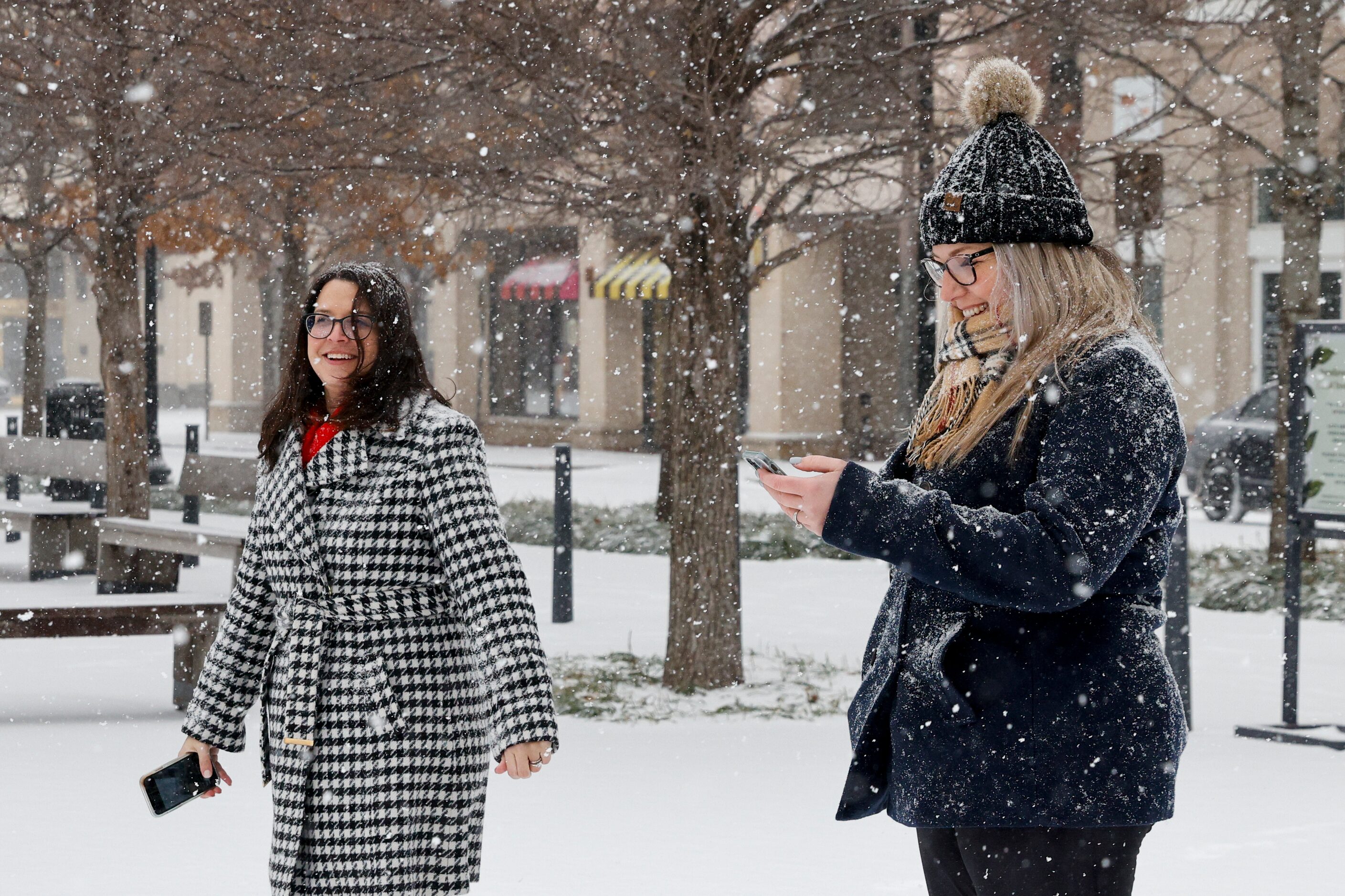 Allyson Vogt of Baton Rouge (left) and Katie Speer of Jacksonville, Florida take pictures as...