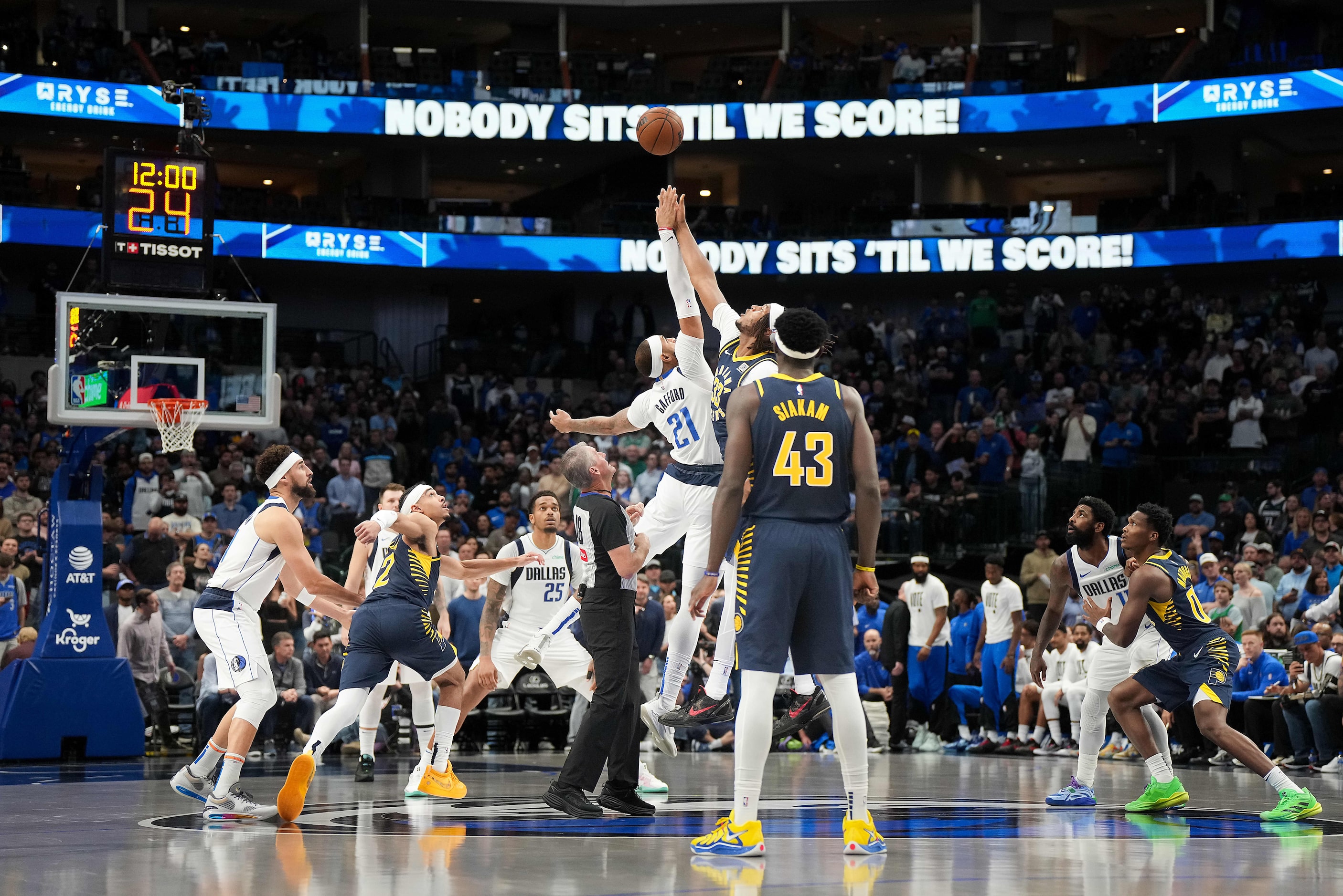 Indiana Pacers center Myles Turner (33) wins the opening tipoff against Dallas Mavericks...