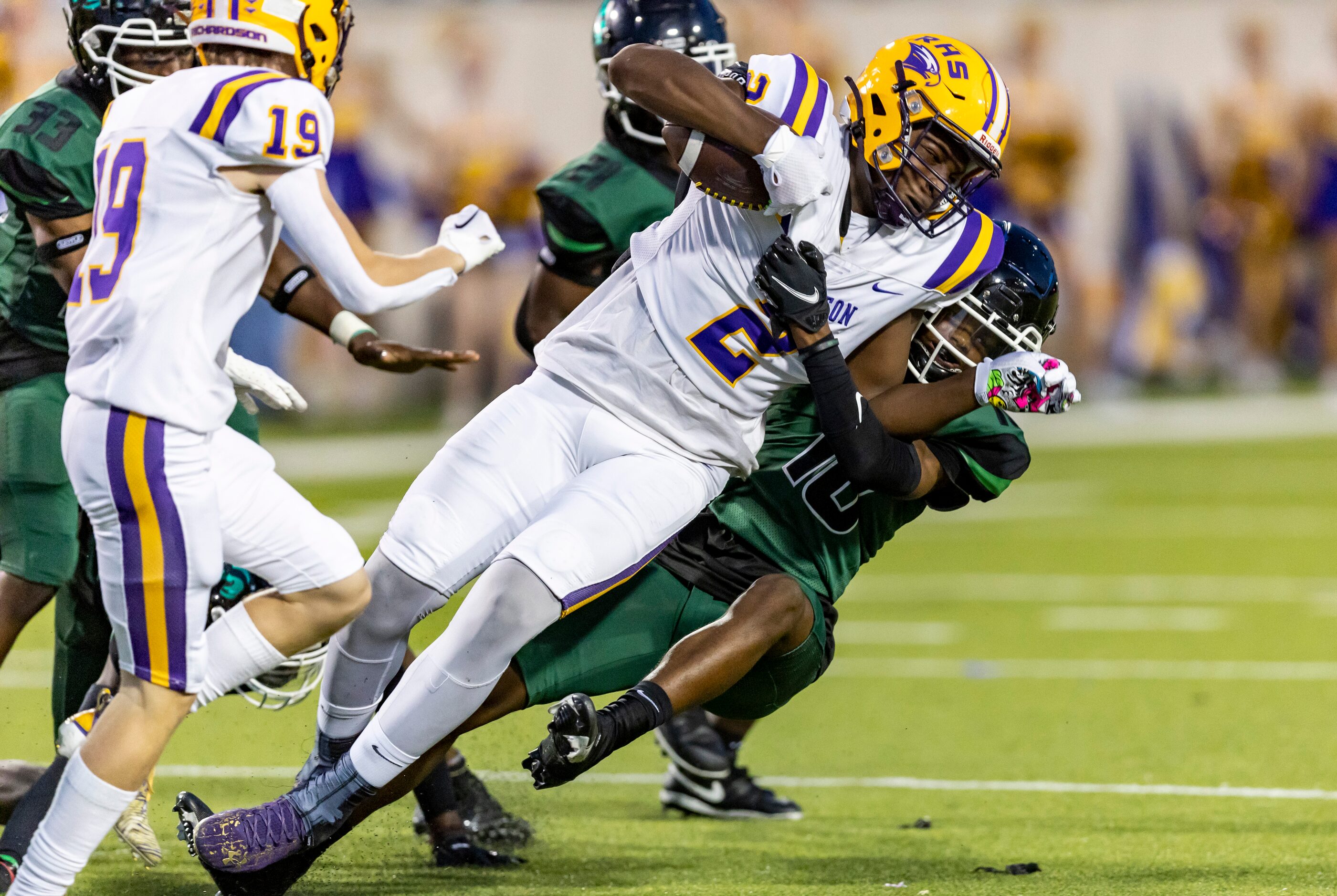 Berkner junior defensive back Anthony Jones (10) tackles Richardson sophomore running back...