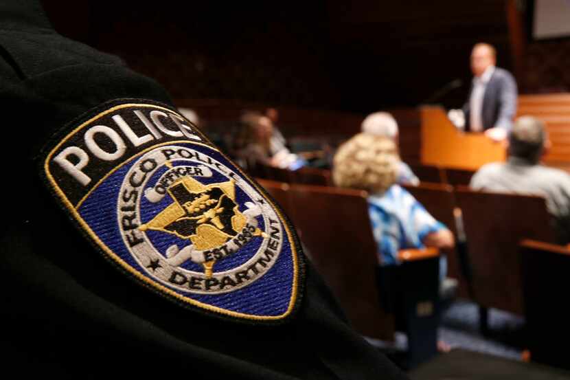 During a meeting at City Hall, Frisco Police Chief John Bruce (left) listened to Mayor Jeff...