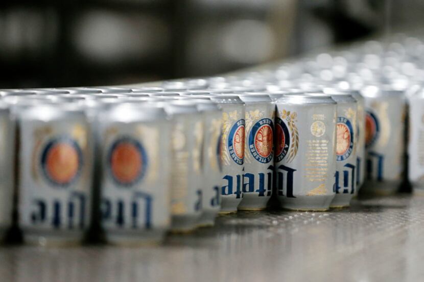 Cans on the line for filling at MillerCoors Fort Worth brewery in Fort Worth on Friday,...