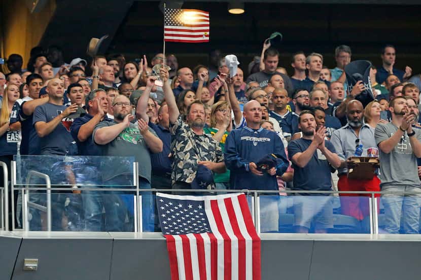 Fans stand during the national anthem before the Green Bay Packers vs. the Dallas Cowboys...