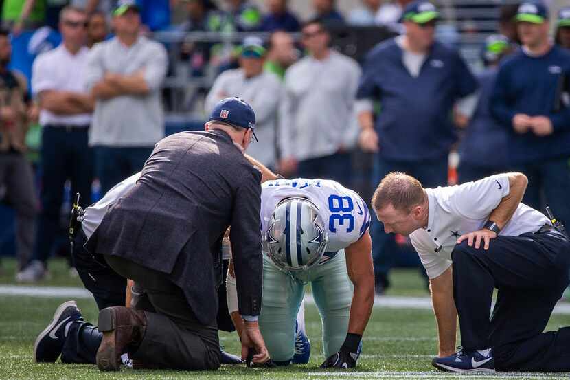 Dallas Cowboys defensive back Jeff Heath (38) receives attention after begin injured during...