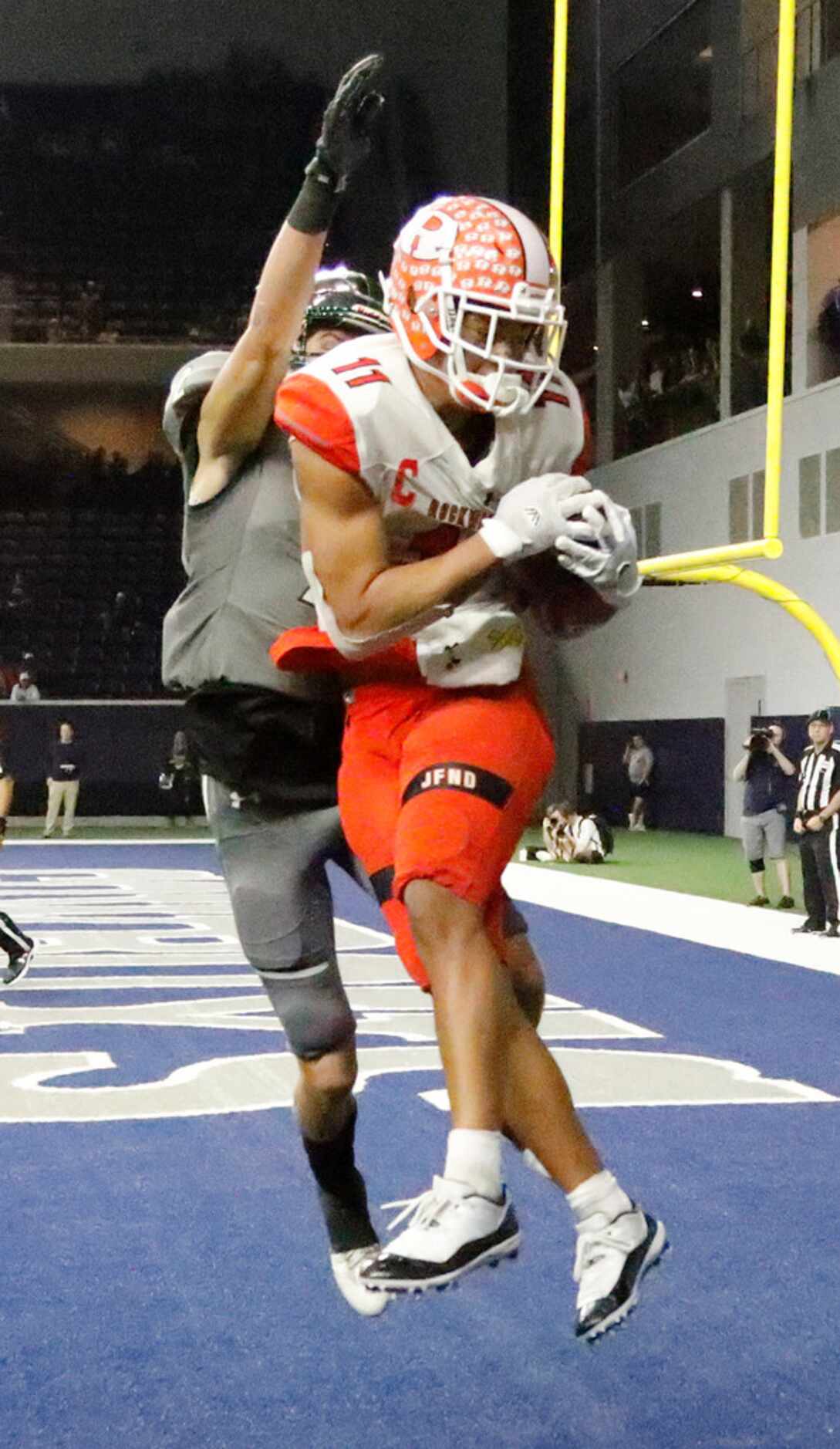 Rockwall High School wide receiver Jaxon Smith (11) catches a touchdown pass with five...
