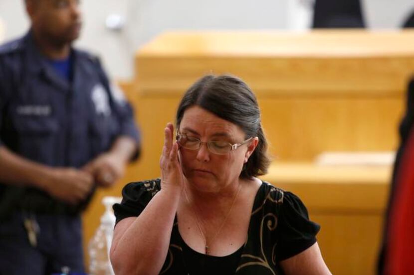 
Tammy Lowe, a former Grand Prairie teacher, becomes emotional while on trial for...