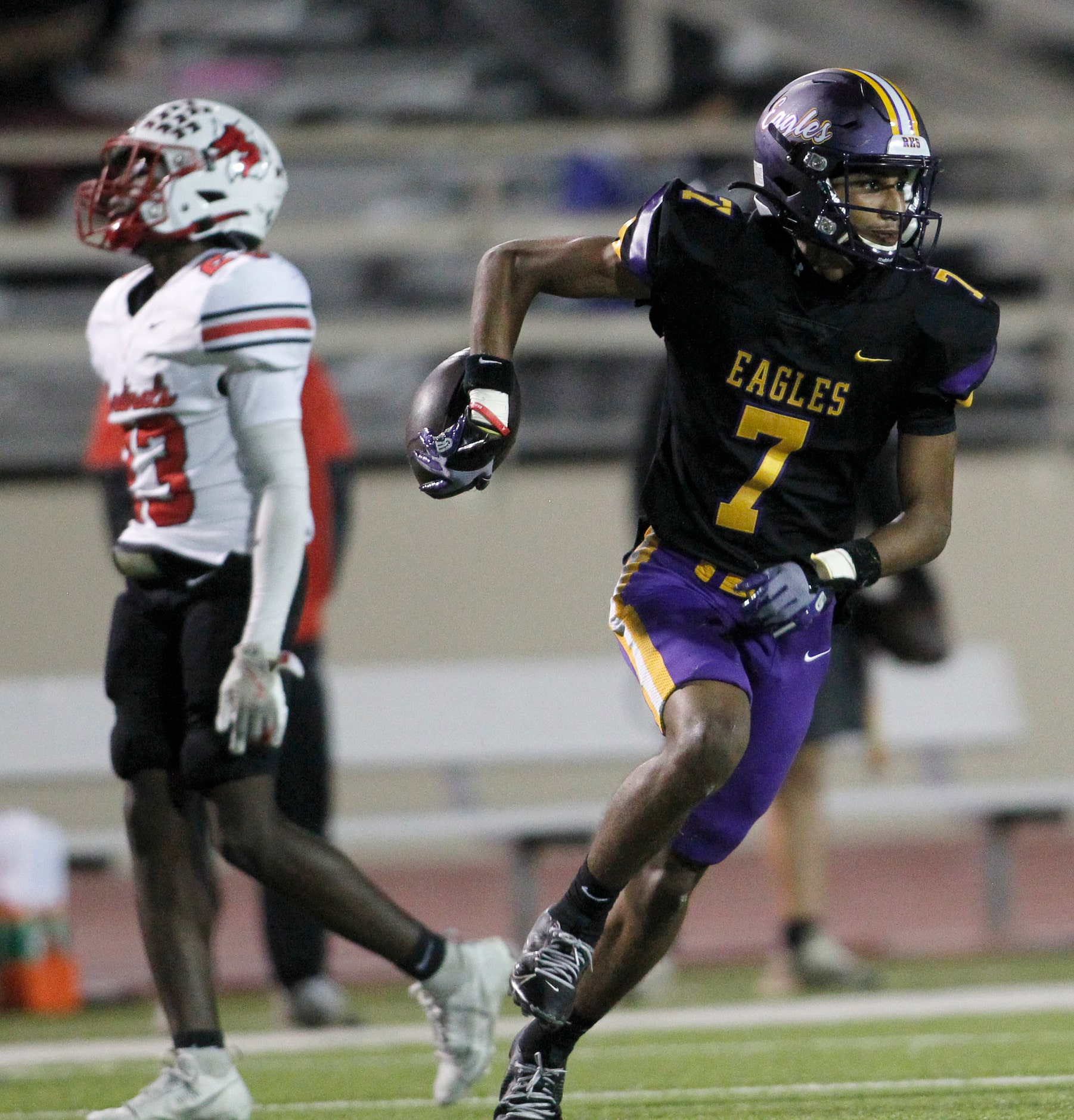 Richardson Eagles quarterback Micheal Allen (7), right, celebrates his second quarter...