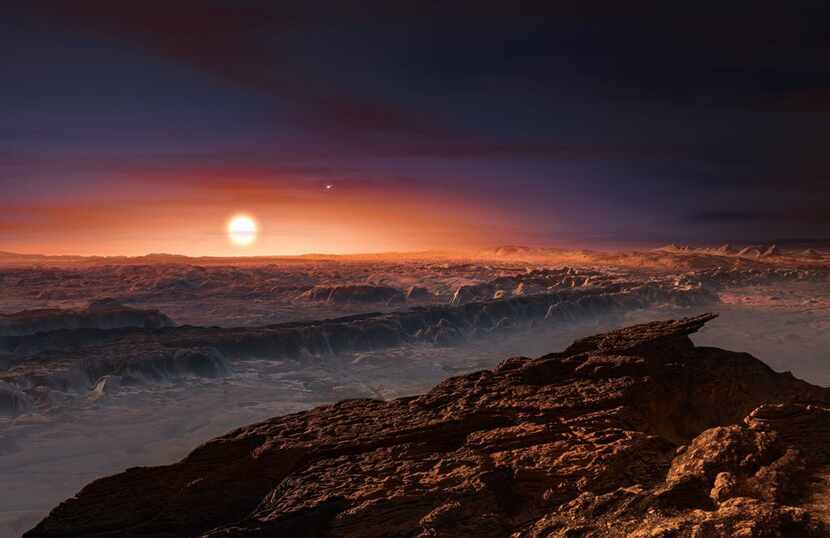 This artist's impression shows a view of the surface of the planet Proxima b orbiting the...