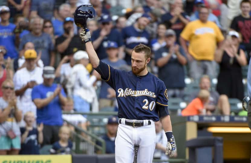 Milwaukee Brewers' Jonathan Lucroy tips his cap after getting a standing ovation from fans...