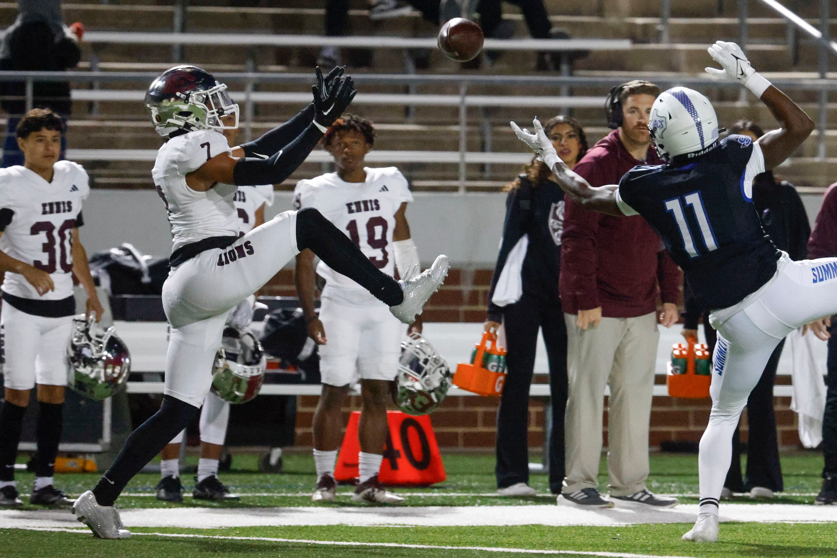 Ennis High’s Wondame Davis Jr. (left) intercepts a pass intended for Mansfield Summit High’s...