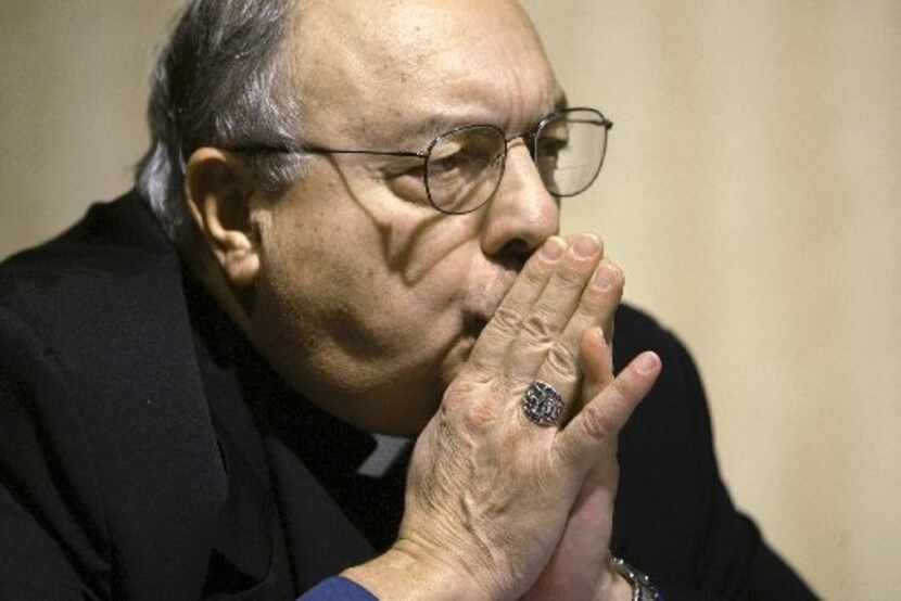 Bishop Joseph A. Galante of Dallas, Texas listens intently as he participates on a panel of...
