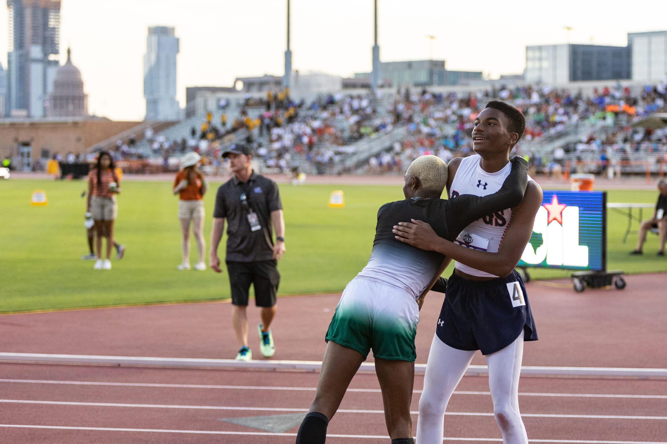 Kody Blackwood of McKinney North, right, hugs Kendrick Smallwood of Mesquite Poteet after...