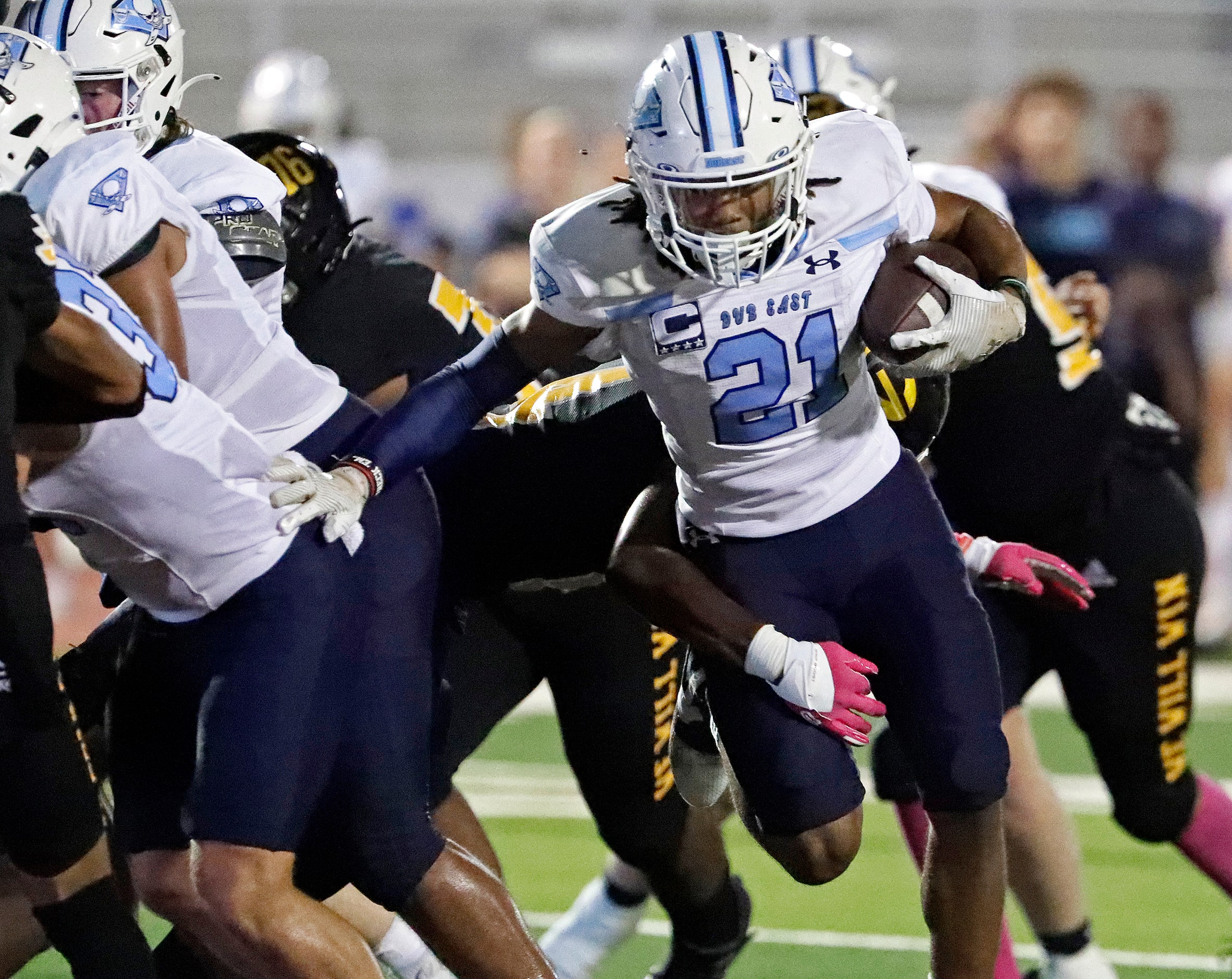 Wylie East High School defensive back Michael Henderson III (21) runs for a short yardage...