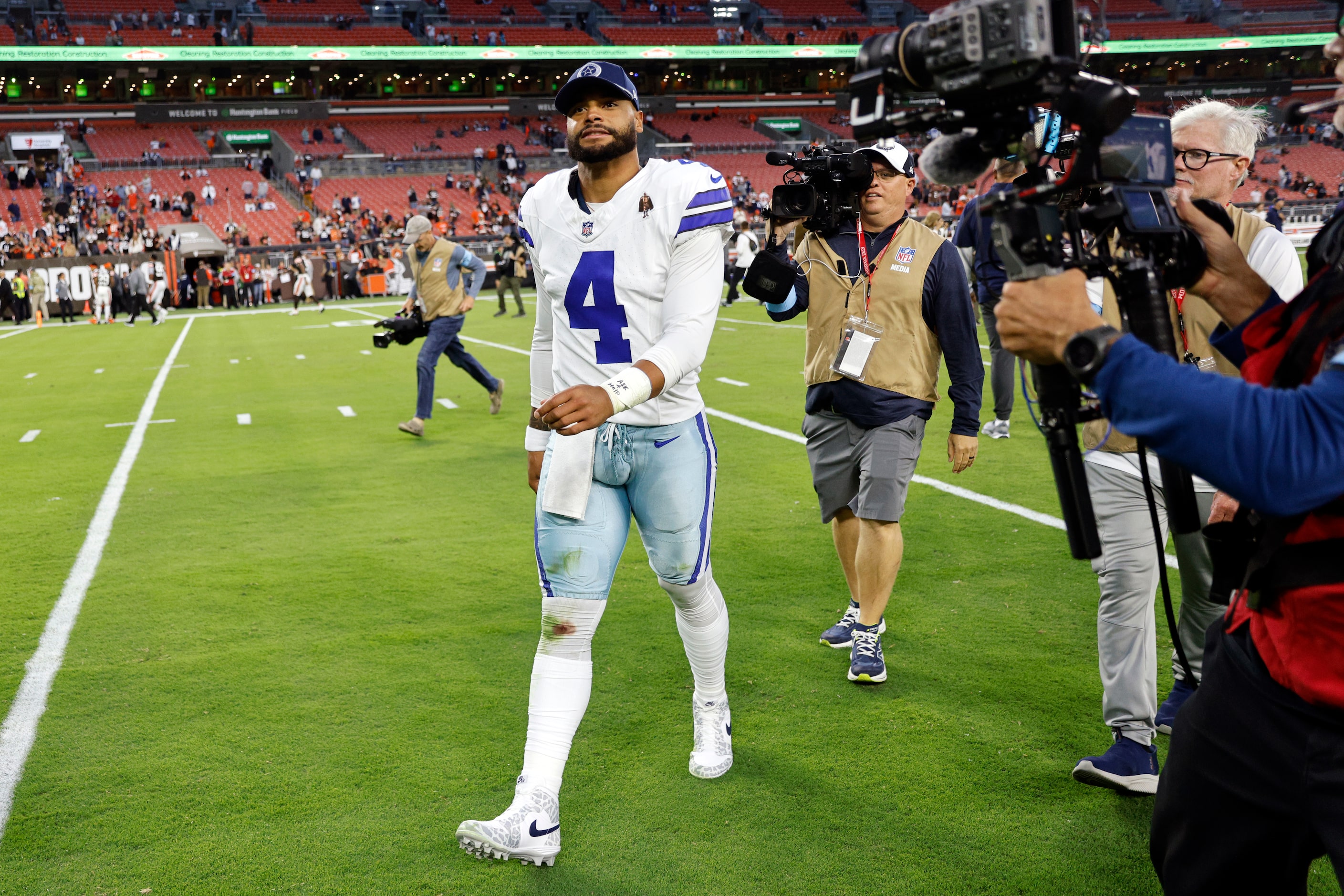 Dallas Cowboys quarterback Dak Prescott (4) walks off the field after a game against the...