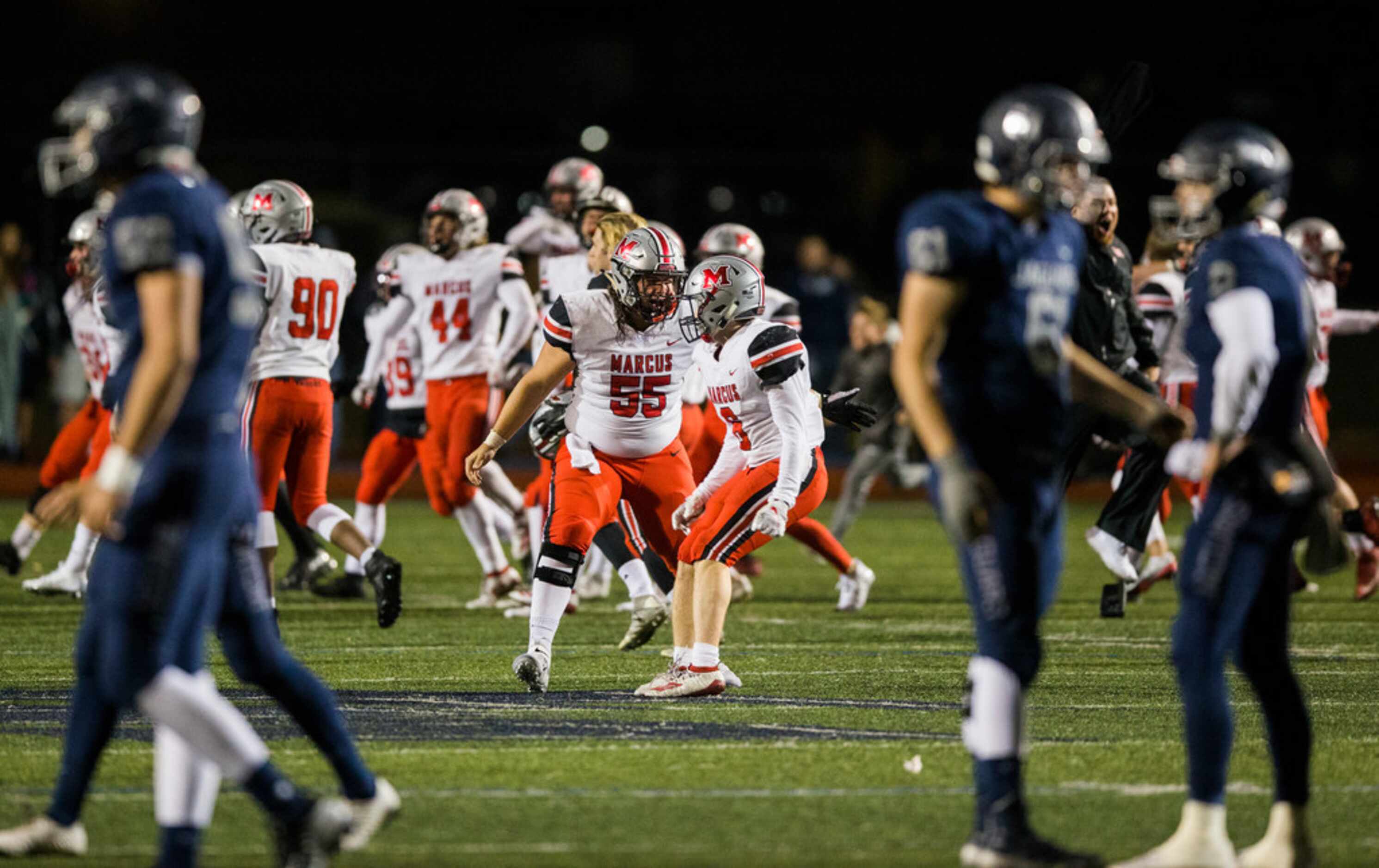 Flower Mound Marcus celebrates a 34-31 win over Flower Mound on Friday, October 25, 2019 at...