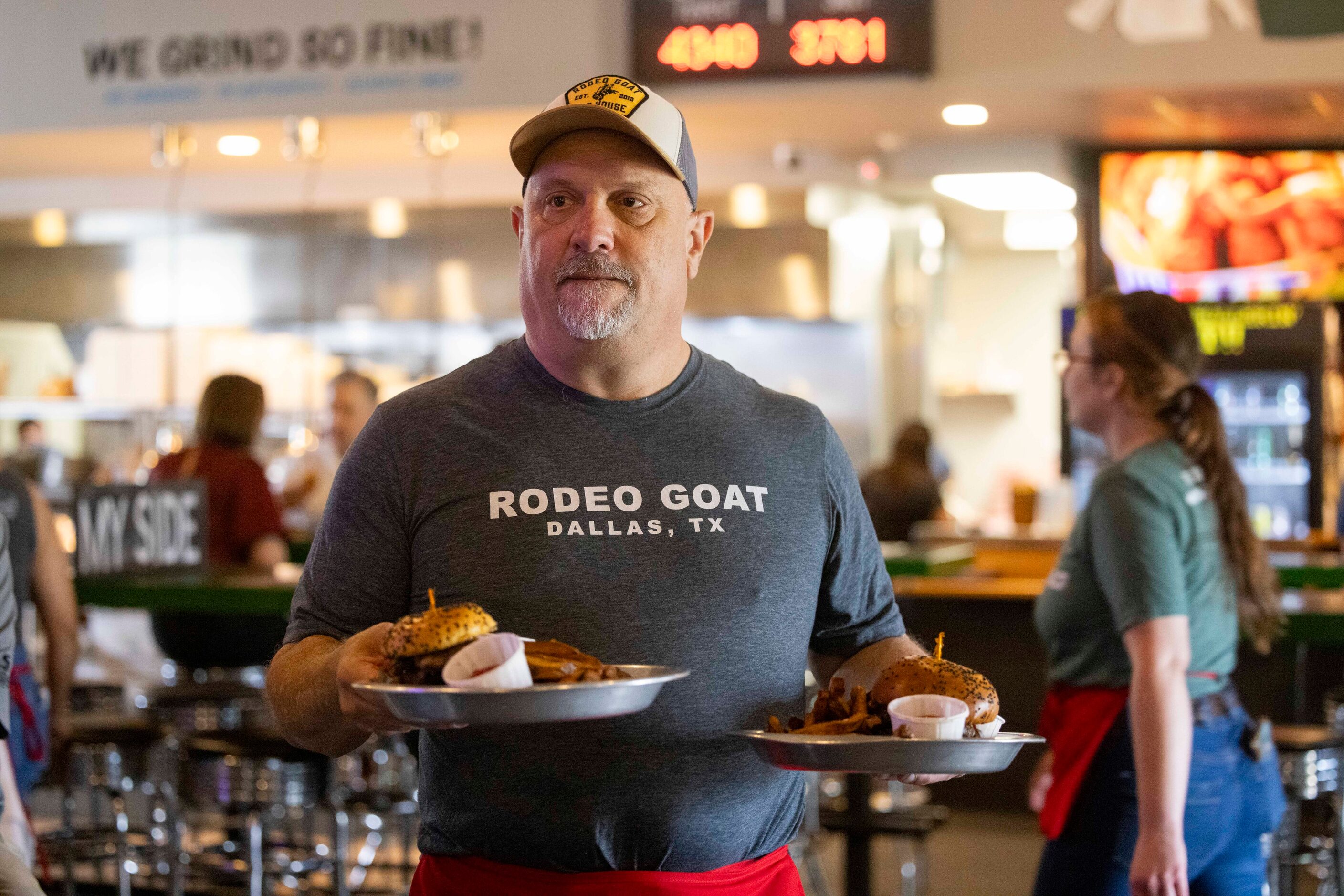 The Dallas Morning News’ Rangers reporter delivers food to a table as he "works a shift"...