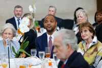 Dallas Mayor Eric Johnson (center) listens to New York Times opinion columnist David Brooks...