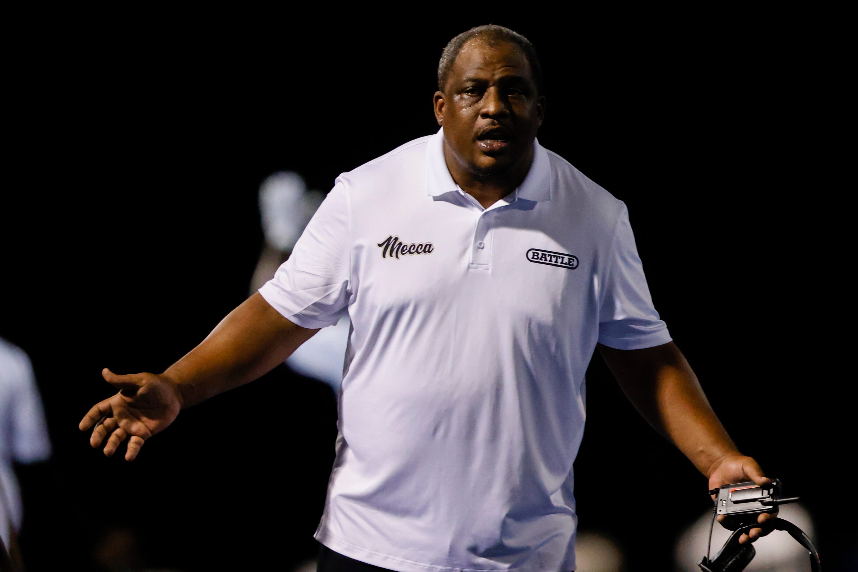 South Oak Cliff’s coach Jason Todd talks to a referee about a call during a play in the...