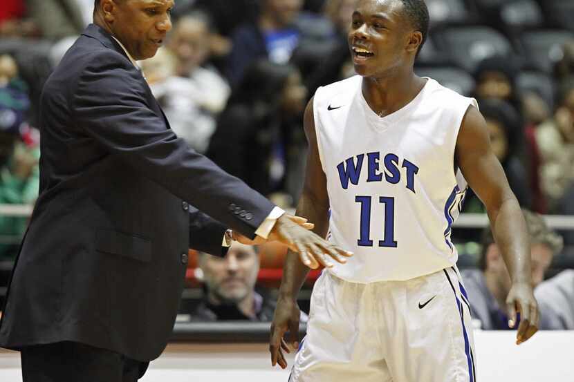 Plano West head coach Anthony Morgan gives directions to his guard Derrick Aimes (11) in the...