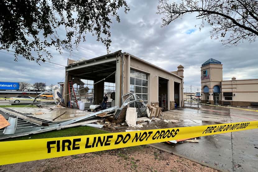 Storm damage is seen at Mustang Elite Car Wash & Lube Center on Ira E. Woods Avenue in...