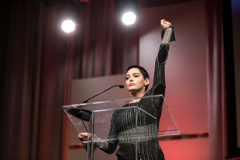 In this 2017 file photo, Rose McGowan raises her fist as she speaks during The Women's...
