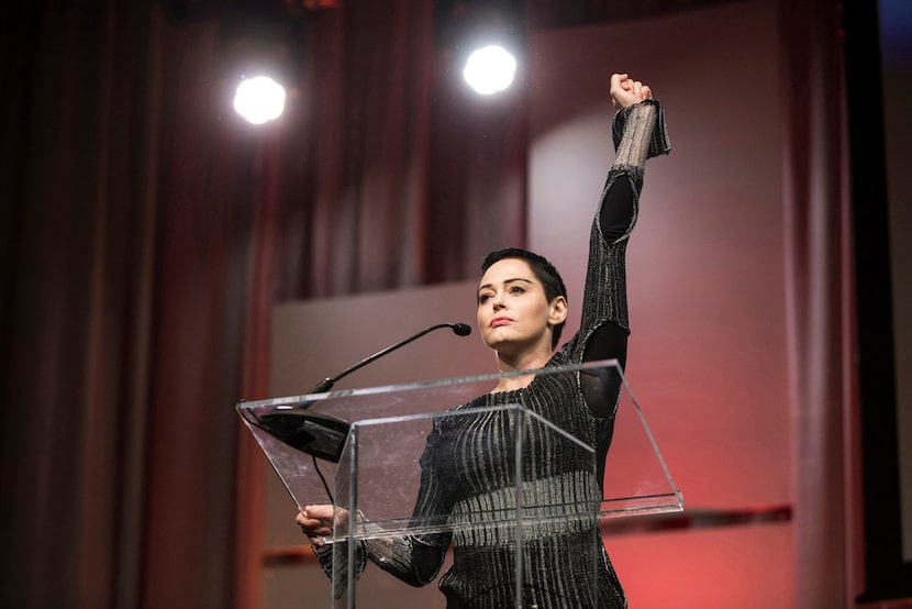 In this 2017 file photo, Rose McGowan raises her fist as she speaks during The Women's...