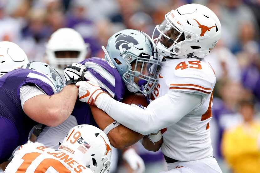 Kansas State running back Alex Barnes (34) is stopped at the line of scrimmage by Texas...