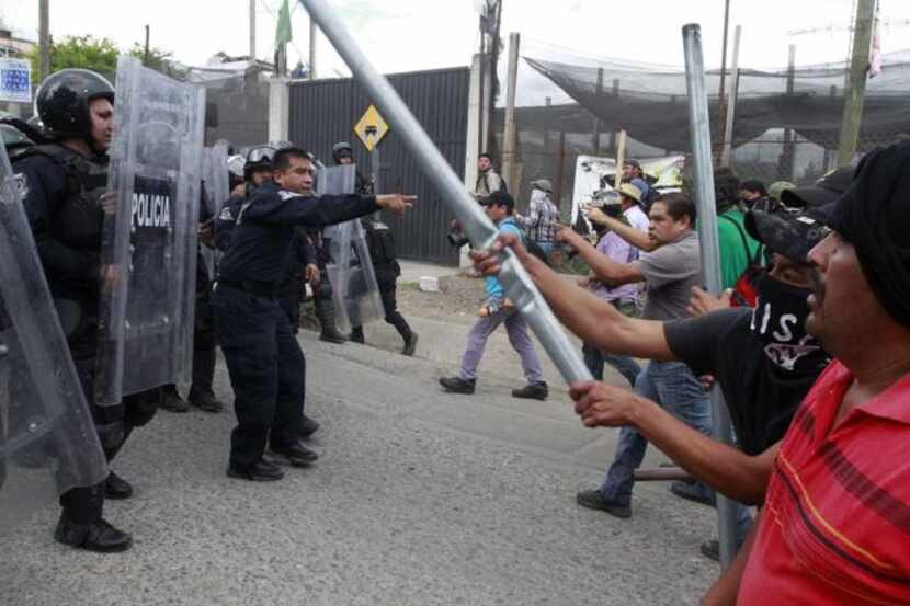 
Protesters clashed with riot police during a protest in Chilpancingo, Guerrero State on...