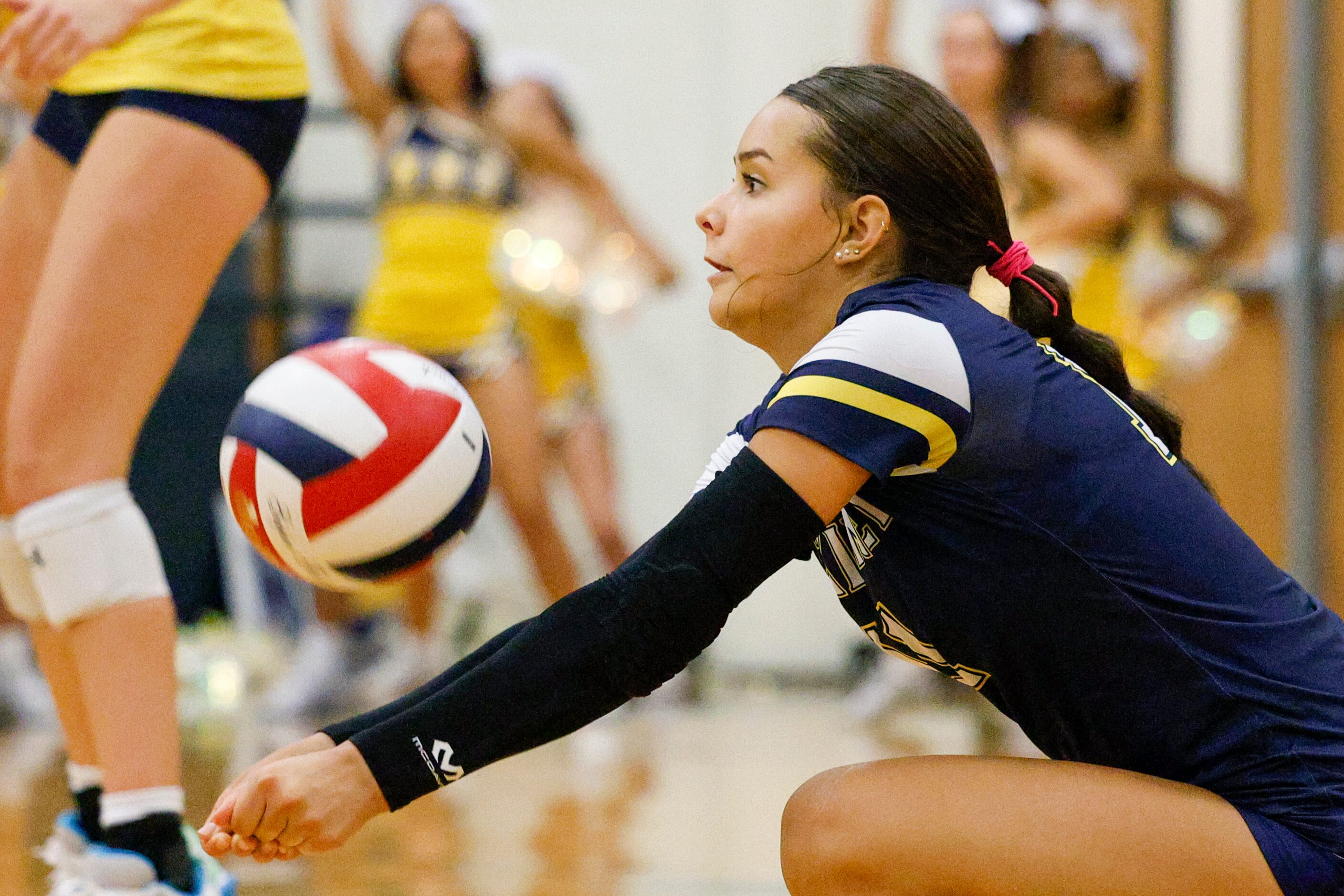 McKinney’s Keira Gallegos (11) digs the ball during a volleyball match against McKinney Boyd...