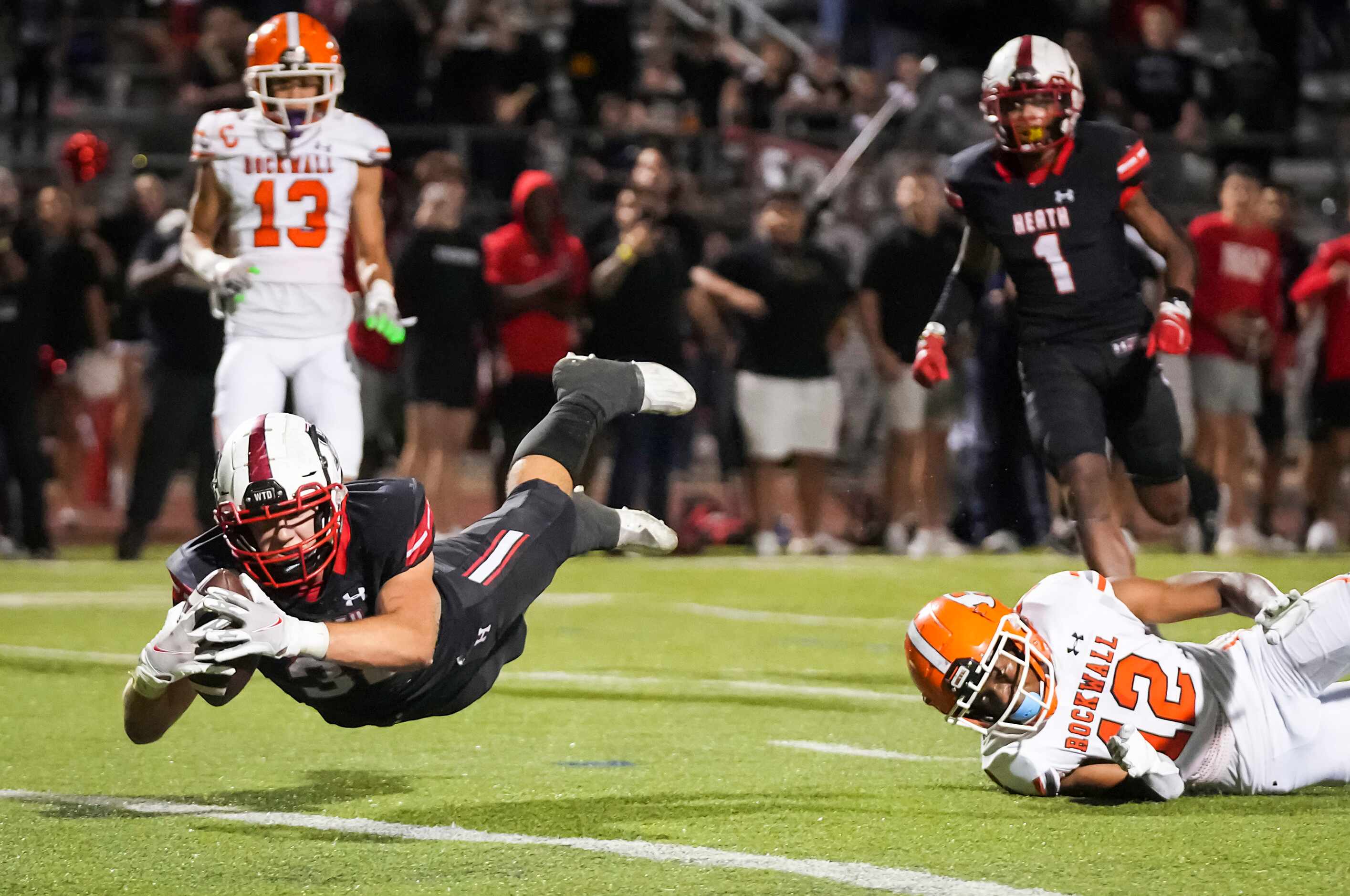 Rockwall-Heath tight end  Lance Mason (38) dives for the end zone to score a 21-yard...