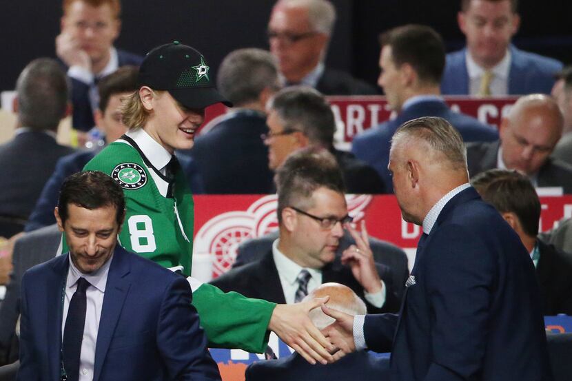 Albin Eriksson greets Dallas Stars officials after being selected with the 44th pick from...