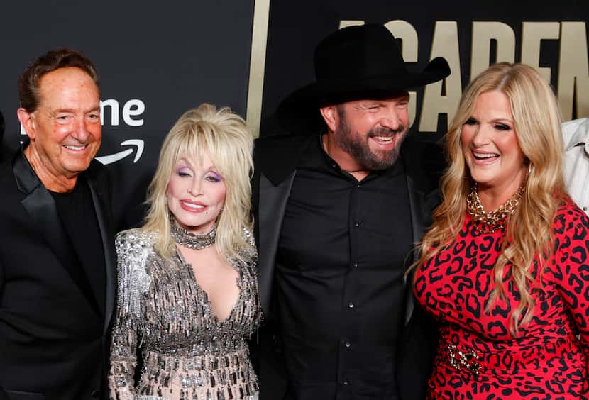 Dolly Parton arrives on the red carpet during the 58th Academy of Country Music Awards on...