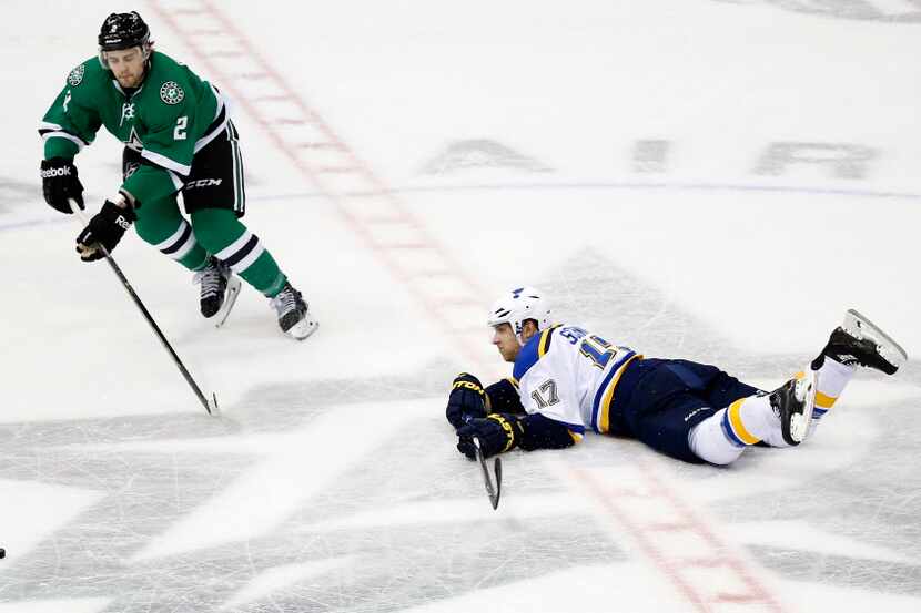 St. Louis Blues left wing Jaden Schwartz (17) dives to clear the puck away from Dallas Stars...
