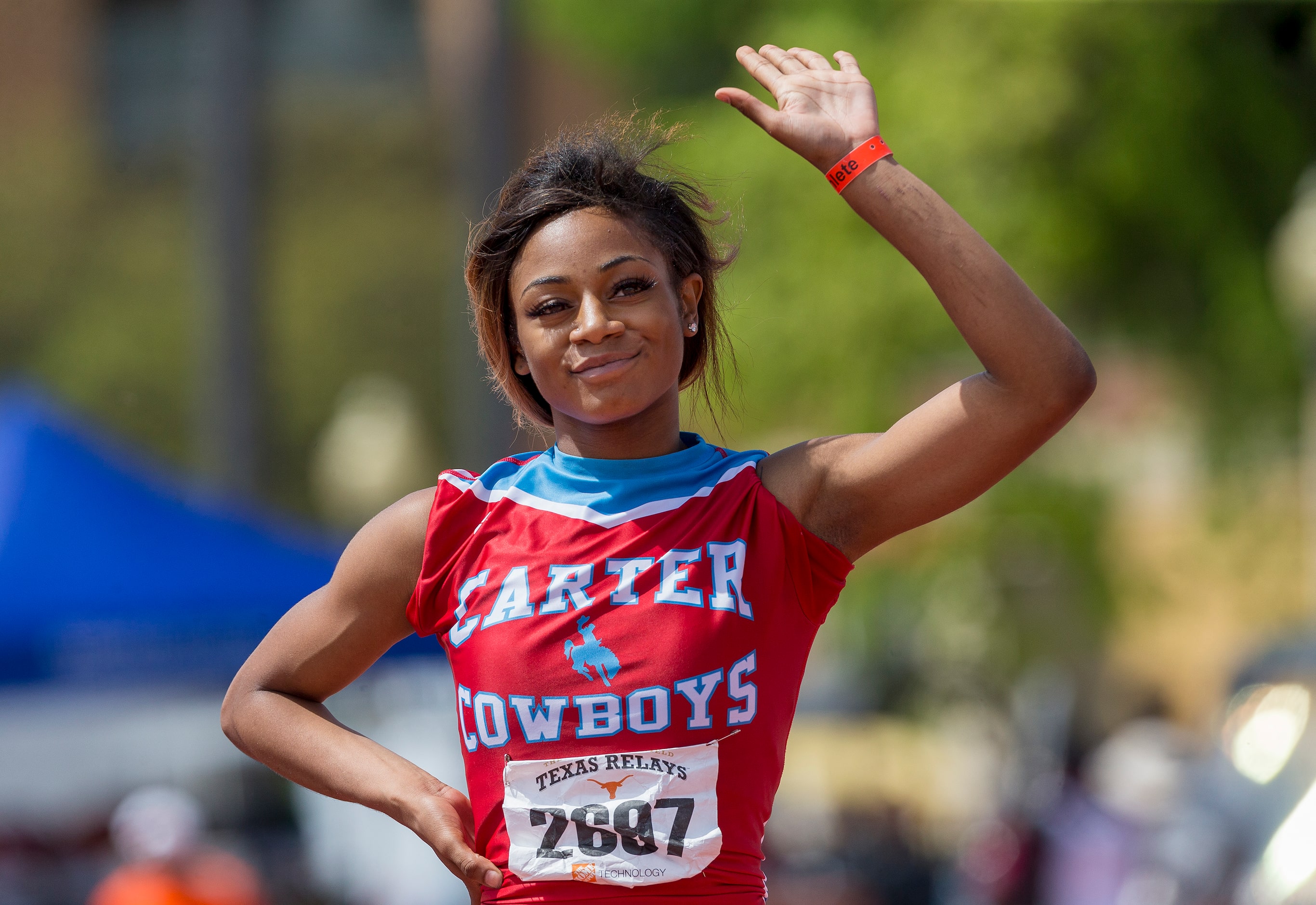 Dallas Carter's Sha'Carri Richardson (2697) celebrates finishing first in the girls Division...